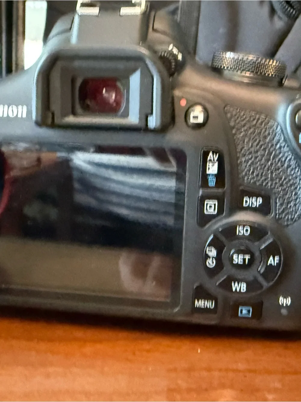 Canon EOS Rebel T5i Black DSLR with Long Black Telephoto Lens